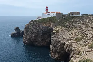 Steep Cliff Coastal Area Prints: Lighthouse on a cliff overlooking the open sea