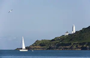 Start Point Lighthouse Prints: Lighthouse of Start Point, sailing boat in front