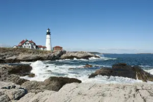 USA Travel Images Prints: Lighthouse, waves breaking on rocks