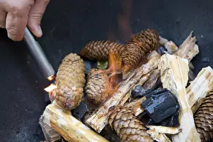 Charcoal Burning Process Prints: Lighting a fire for a barbecue