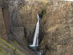 Basalt Columns Formation Prints: Litlanesfoss waterfall, hexagonal basalt columns