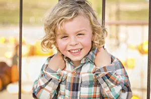 Rustic Ranch Setting Prints: Little boy having fun in a rustic ranch setting at the pumpkin patch