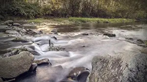 Evening Sun Water Scene Prints: Long exposure of the mountain river in the rays of the setting sun