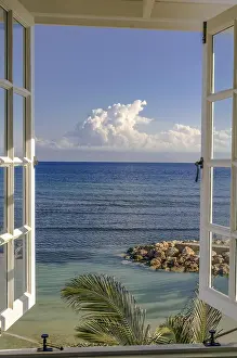 Deserted Beach Prints: Loooking out of a window on the ocean