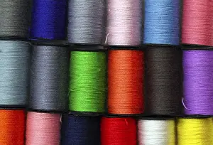 Deserted Background Prints: Lot of colored thread spools, background