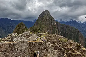 Inca City Peru Prints: Machu Picchu with dramatic cloudscape and visible mountain