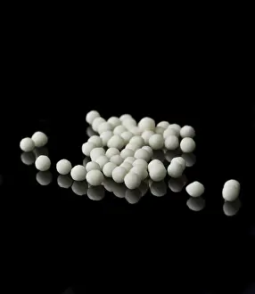 Alternative Medicine Prints: Macro Print of Homeopathic Medication on Black Surface