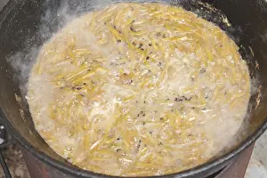 Asian Cuisine Prints: The making of pilaf in cauldron