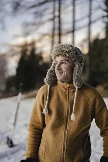 Man In Snow Prints: Man with cap in the snow