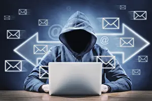 Data Security Threats Prints: man on a computer sending spam mail