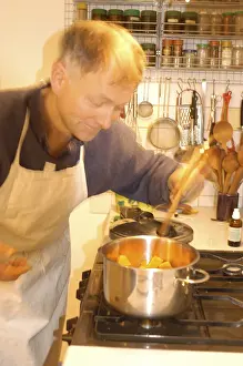 Man In The Kitchen Prints: Man is cooking