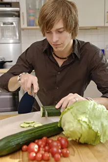 Meal Preparation Tips Prints: Man cuts cucumbers