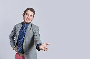 Young Man In Suit Prints: Man extending his hand inviting