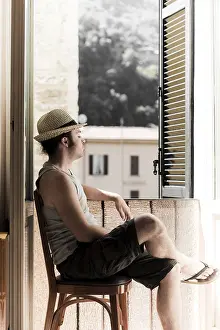 European Summer Atmosphere Prints: Man with hat sitting next to window
