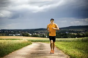 Recreational Activity Prints: Man jogging through the fields