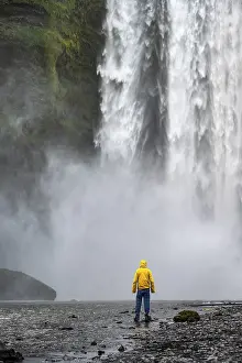 Young Man In Front Of Waterfall Prints: Man in front of large waterfall