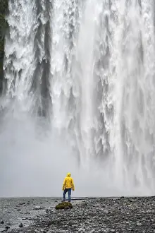 Iceland Tourist Attraction Prints: Man in front of large waterfall