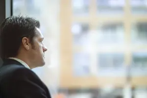 Businessman In Office Prints: Man looking out