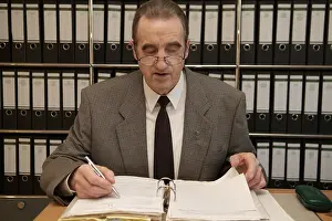 Elderly Woman At Work Prints: Man in the office