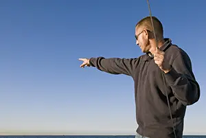 Baltic Sea Landscape Photo Prints: Man points to the horizon