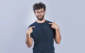Confused Man Prints: Man with puzzled face pointing at himself