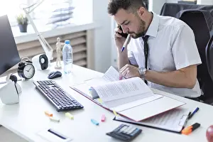 Scientist In Office Prints: A man is sitting in the office