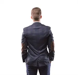 Caucasian Man Photography Prints: Man stands with his back to the camera and looking at something