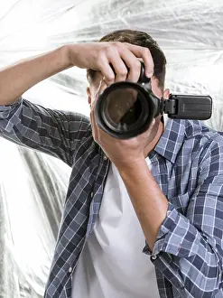 Male Portrait Photography Prints: Man taking with professional camera
