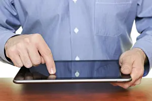 Tablet Pc Usage Prints: Man using a tablet computer