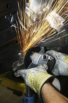 Protective Clothing Detail Prints: Man working with angle grinder