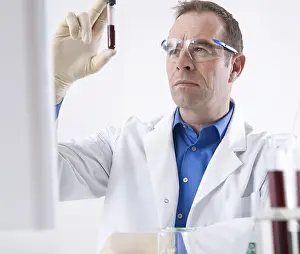 Scientist Experiment Prints: Man working on an experiment in a laboratory