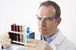 Scientist Experiment Prints: Man working on an experiment in a laboratory