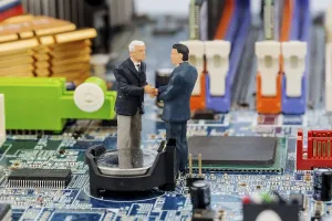 Printed Circuit Board Image Prints: Two managers on computer board