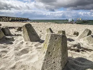 Deserted Beach Prints: Massive concrete breakers stacked on the beach