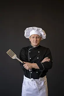 Meal Preparation Prints: Medium shot chef posing with spatula