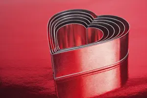 Red Background Prints: Some of the metal hearts shaped over red background