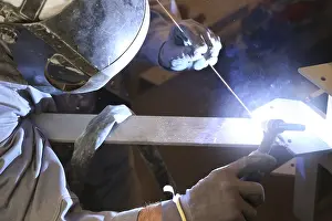Industrial Craftsman Prints: Metal worker during welding work