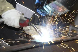 Industrial Worker Prints: Metalworker during welding work in his workshop