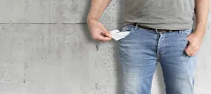 Financial Struggle Prints: midsection of man turning his empty pockets inside out