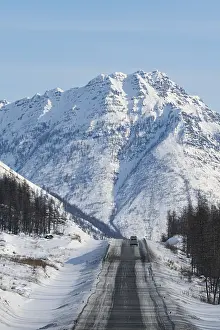 Deserted Russian Roads Prints: Minivan driving on the Road of Bones