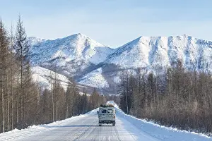 Deserted Russian Roads Prints: Minivan driving on the Road of Bones