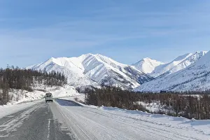 Deserted Russian Roads Prints: Minivan driving on the Road of Bones