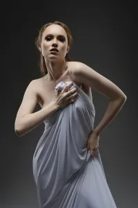 Elegant Model Pose Prints: A model elegantly poses, draped in a light fabric