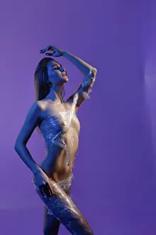 Elegantly Posed Model Prints: A model poses elegantly, wrapped in plastic