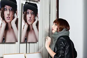 White Background Fashion Model Prints: Model posing in front of a showcase with her picture