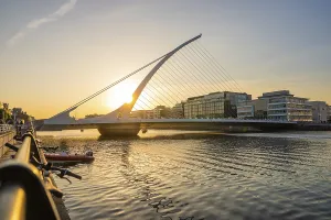 European Modern Architecture Style Prints: Modern bridge over a river at sunset