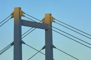 Atmospheric Evening Light Shot Prints: A modern bridge at sunset with clear cable structures and a cloudless sky