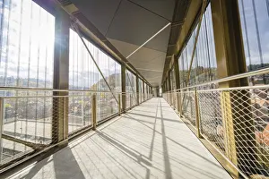 European Modern Architecture Prints: Modern footbridge with sun rays and shadows through the grid
