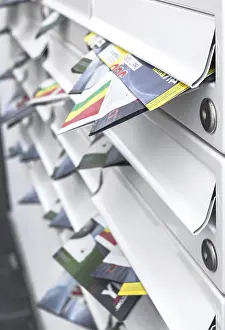 Shallow Depth Of Field Prints: Modern mailboxes filled of leaflets