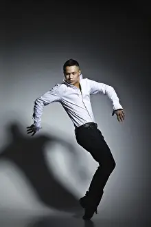 Fashionable Studio Shot Prints: Modern style dancer posing on grey studio background